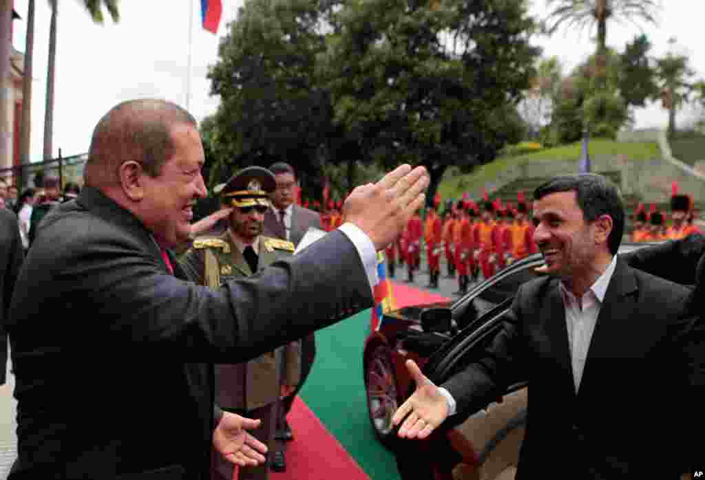 Mr. Ahmadinejad is welcomed by Venezuela's President Hugo Chavez at Miraflores Palace in Caracas on January 9, 2012. (Reuters)