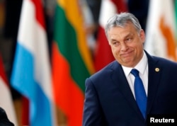 FILE - Hungarian Prime Minister Viktor Orban arrives at the EU summit in Brussels, Belgium, March 9, 2017.