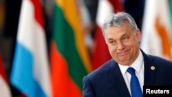 FILE - Hungarian Prime Minister Viktor Orban arrives at the EU summit in Brussels, Belgium, March 9, 2017. Since his return to power in 2010, his allies have greatly increased their ownership of newspapers, broadcasters and online media, turning the outlets into unquestioning supporters of the government.