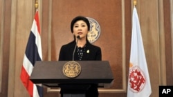 Thai Prime Minister Yingluck Shinawatra speaks at a news conference after a cabinet meeting at an Air Force base in Bangkok, Thailand, Dec. 25, 2013.