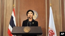 Thai Prime Minister Yingluck Shinawatra speaks at a news conference in Bangkok, Dec. 25, 2013.