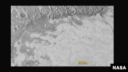 New Horizons discovers flowing ices in Pluto’s heart-shaped feature. In the northern region of Pluto’s Sputnik Planum (Sputnik Plain), swirl-shaped patterns of light and dark suggest that a surface layer of exotic ices has flowed around obstacles and into depressions, much like glaciers on Earth. (NASA/JHUAPL/SwRI)