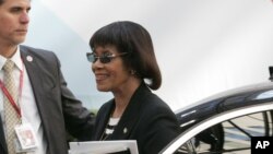 FILE - Jamaica's Prime Minister Portia Simpson Miller, right, arrives for the EU-CELAC summit in Brussels, June 11, 2015. 