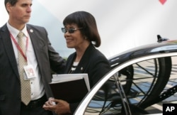 FILE - Jamaica's Prime Minister Portia Simpson Miller, right, arrives for the EU-CELAC summit in Brussels, June 11, 2015.