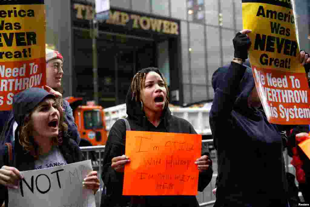 Demonstrators gather near Trump Tower in New York.