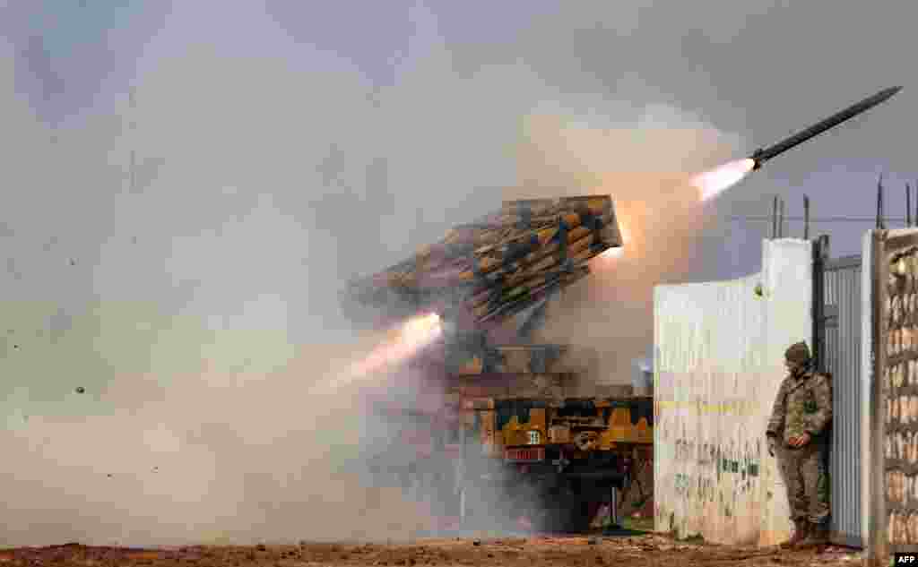 A Turkish military mobile rocket launcher fires from a position in the countryside of the Syrian province of Idlib toward Syrian government forces&#39; positions in the countryside of neighboring Aleppo province.