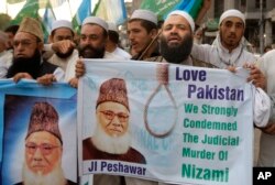 FILE - Pakistanis rally to condemn the execution of Bangladesh's Jamaat-e-Islami party chief Motiur Rahman Nizami, May 11, 2016, in Peshawar, Pakistan. Nizami was executed for crimes committed during Bangladesh's independence war against Pakistan.