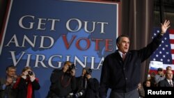 Republican presidential nominee Mitt Romney waves to the crowd at the conclusion of a campaign rally in Virginia Beach, Virginia, November 1, 2012.