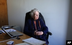 FILE - In this Dec. 9, 2014, photo, Nancy Hatch Dupree looks out of a window at her office during an interview with The Associated Press at the Afghanistan Center in Kabul University.