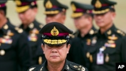 FILE - Thai Prime Minister Prayuth Chan–ocha arrives to attend an establishment anniversary of the 21st Infantry Regiment, Queen's Guard in Chonburi Province, Aug. 21, 2014.