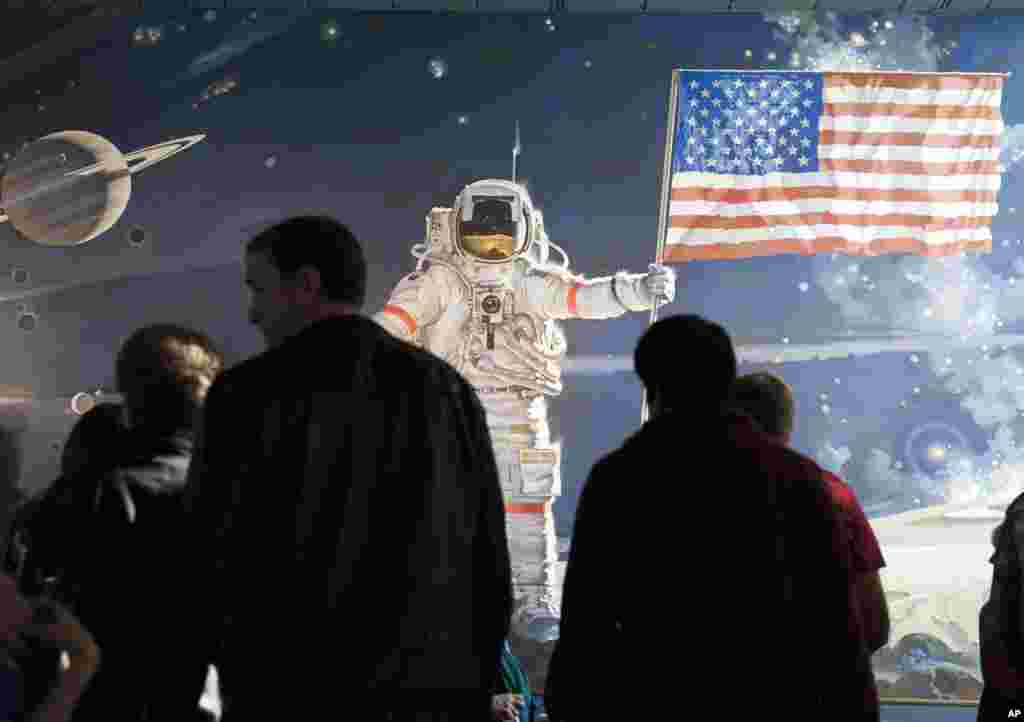 People form a tour group at the Smithsonian's Air and Space Museum in Washington, D.C., Oct. 17, 2013.