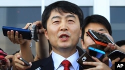 Lee Seok-ki of the leftist Unified Progressive Party speaks before leaving the National Assembly in Seoul, South Korea, Sept. 4, 2013. 
