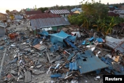 Debris and damaged properties are seen after the earthquake and tsunami hit an area in Wani, Donggala, Central Sulawesi, Indonesia, Oct. 3, 2018.