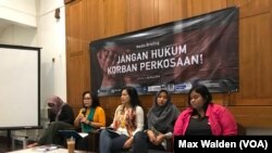 FILE - Members of the Justice Alliance for Rape Victims appear at a joint press conference in Jakarta, Indonesia on August 5, 2018.