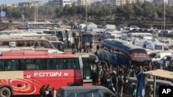 Syrians evacuated from the embattled Syrian city of Aleppo during the cease-fire arrive at a refugee camp in Rashidin, near Idlib, Syria, Dec. 20, 2016.