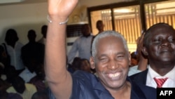 The Guinea Electoral Commission's newly elected president Bakary Fofana waves moments after being elected on November 1, 2012 in Conakry.