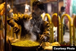 A man sells peas on the street in India. Could peas one day be used to make something that tastes like a hamburger?