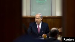 Israel's Prime Minister Benjamin Netanyahu is seen chairing the weekly cabinet meeting in Jerusalem July 28, 2013.