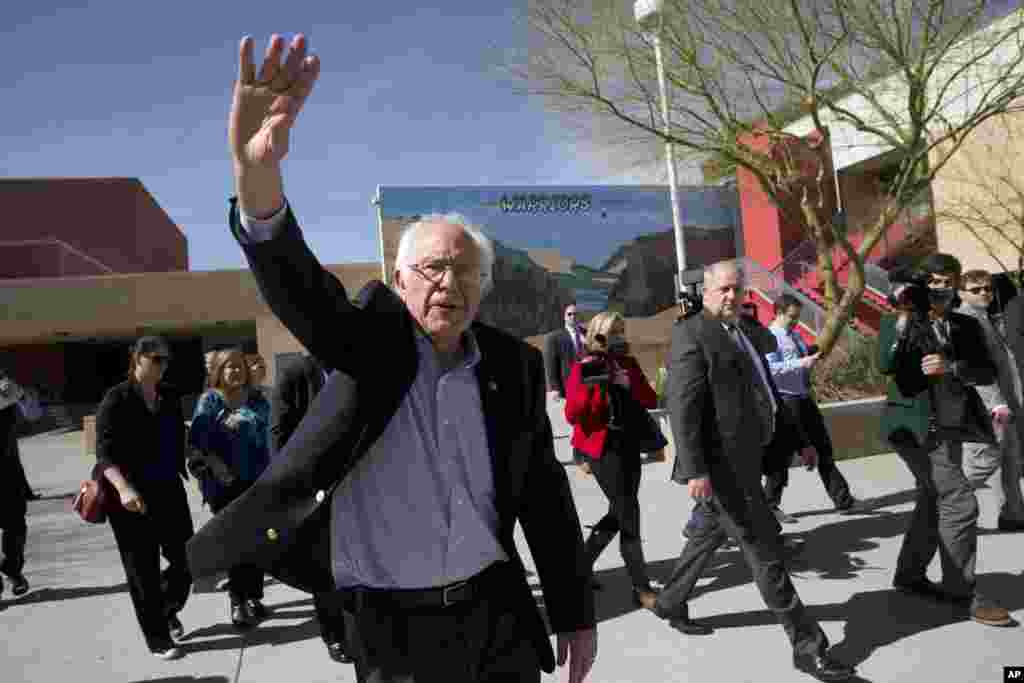 Democratic presidential candidate Sen. Bernie Sanders, I-Vt., waves to voters as he leaves a caucus site, in Las Vegas, Feb. 20, 2016.