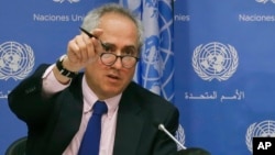 FILE - United Nations Spokesman Stephane Dujarric fields questions during a press conference with U.N. correspondents, June 20, 2017, at U.N. headquarters in New York.