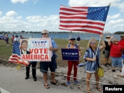 Supporters line President Donald Trump's motorcade route near the Mar-a-Lago Club in Palm Beach, Fla., March 4, 2017.