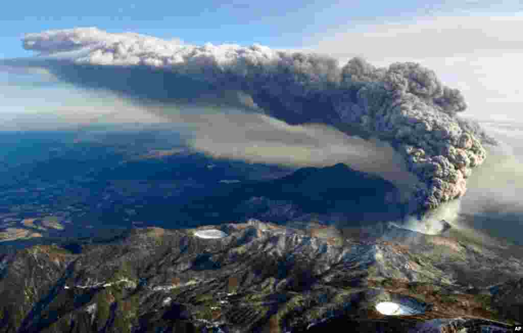 January 27: An aerial view shows Shinmoedake peak erupting between Miyazaki and Kagoshima prefectures in Southern Japan. The volcano prompted authorities to raise alert levels and call for an evacuation of all residents within a 2 km (1.2 miles) radius of