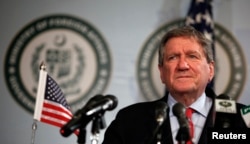 Richard Holbrooke, the U.S. special representative to Pakistan and Afghanistan, listens to a question during a news conference in Islamabad June 19, 2010.