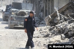 Iraqi units search for survivors and the remains of dead civilians in Old Mosul, Iraq, July 14, 2017.