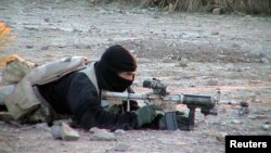 FILE - A U.S. Navy SEAL member provides cover for his teammates advancing on a suspected location of al-Qaida and Taliban forces, Jan. 26, 2002.