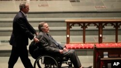 FILE - Former Presidents George W. Bush (L), and George H.W. Bush arrive at St. Martin's Episcopal Church for a funeral service for former first lady Barbara Bush, April 21, 2018, in Houston.