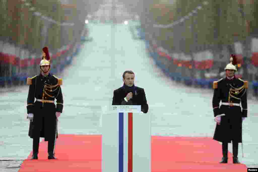 French President Emmanuel Macron delivers a speech during a commemoration ceremony for Armistice Day, 100 years after the end of the First World War at the Arc de Triomphe, in Paris, Nov. 11, 2018.