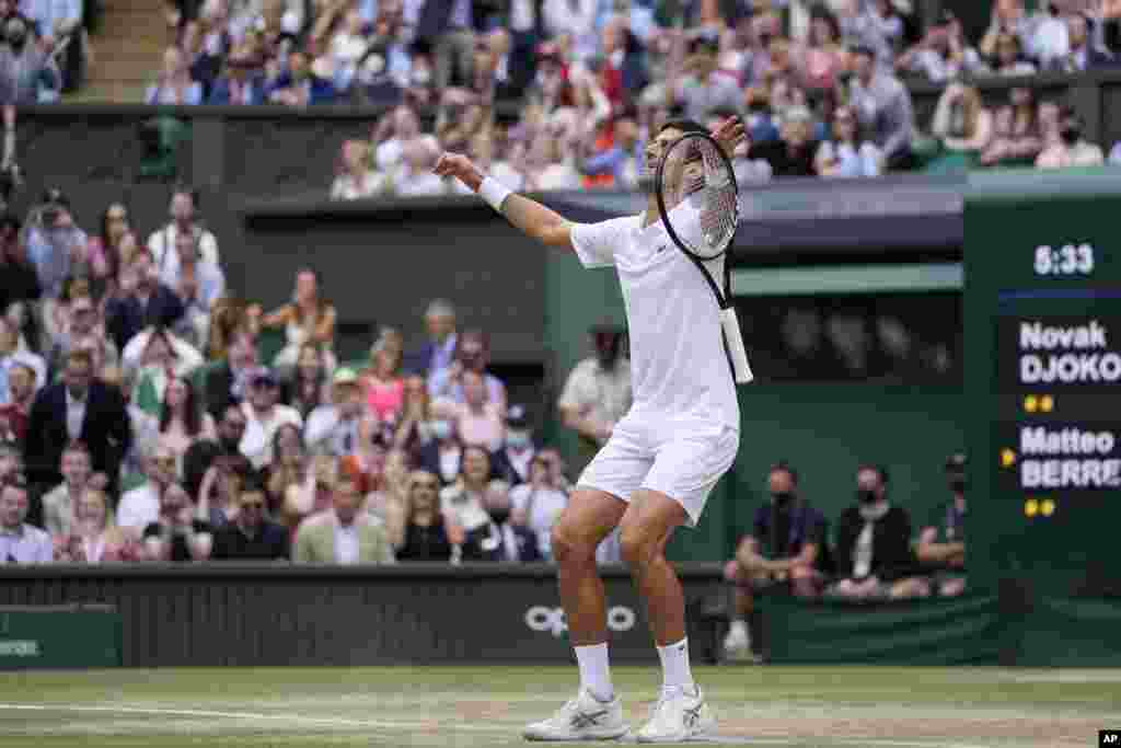 Serbia&#39;s Novak Djokovic celebrates after defeating Italy&#39;s Matteo Berrettini in the men&#39;s singles final on day thirteen of the Wimbledon Tennis Championships in London.