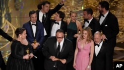 Cast and crew from "Spotlight" celebrate their best picture win at the Academy Awards, Feb. 28, 2016.