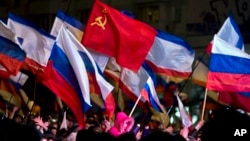 Pro-Russian people celebrate in Lenin Square, in Simferopol, Ukraine, March 16, 2014.