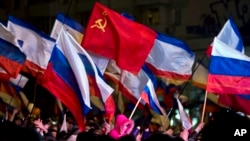 Pro-Russian people celebrate in Lenin Square, in Simferopol, Ukraine, March 16, 2014.