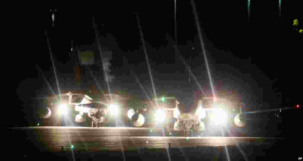 March 20: Two British RAF Tornado GR4 warplanes prepare for take-off from RAF Marham, in England. The U.N. Security Council on Thursday approved a resolution authorizing the use of "all necessary measures" to protect civilians under attack by government