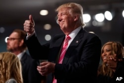 Campaign 2016 Trump: Republican presidential candidate Donald Trump gives a thumbs up during a church service at Great Faith Ministries, Saturday, Sept. 3, 2016, in Detroit.