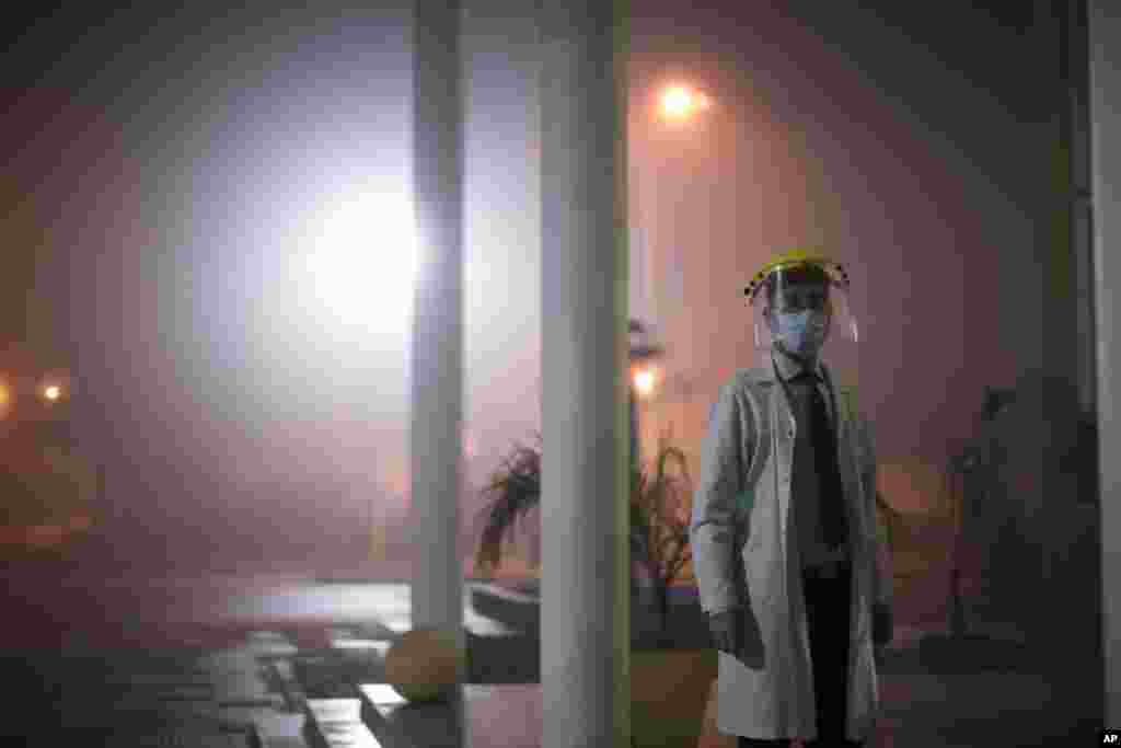 Dr. Matias Norte stands outside a hospital during a government-ordered lockdown to curb the spread of the new coronavirus in Buenos Aires, Argentina, Saturday, July 18, 2020.