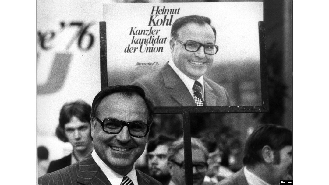 FILE - Helmut Kohl stands in front of an election poster, June 26, 1975, during an election campaign for the West German 1976 general election.