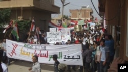 Demonstrators protesting against Syria's President Bashar al-Assad march through the streets after Friday's Prayers in Amude, September 30, 2011.