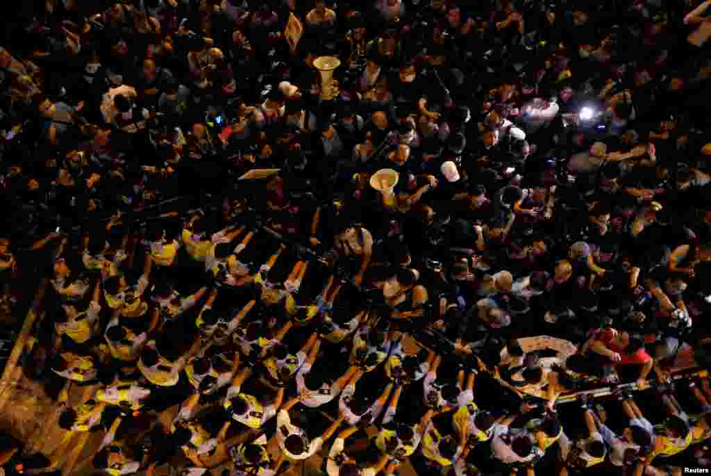 Police stop demonstrators in Hong Kong as they protest against what they call Beijing&#39;s interference over local politics and the rule of law, a day before China&#39;s parliament is expected to announce their interpretation of the Basic Law.