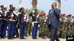 Djibouti's President Ismael Guelleh inspects a guard of honour during his inauguration on May 8, 2016 in Djibouti after his fourth re-election. 