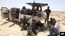 Libyan rebels make their way to frontline, 40 km west of Ajdabiyah, July 18, 2011