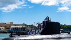 In this photo provided by US Navy, the Virginia-class fast-attack submarine USS Illinois (SSN 786) returns home to Joint Base Pearl Harbor-Hickam from a deployment in the 7th Fleet area of responsibility on Sept. 13, 2021.