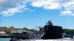 In this photo provided by US Navy, the Virginia-class fast-attack submarine USS Illinois (SSN 786) returns home to Joint Base Pearl Harbor-Hickam from a deployment in the 7th Fleet area of responsibility on Sept. 13, 2021.