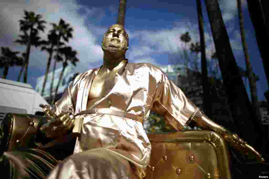 A statue of Harvey Weinstein on a casting couch made by artist Plastic Jesus is seen on Hollywood Boulevard near the Dolby Theatre during preparations for the Oscars in Hollywood, Los Angeles, California.