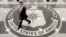 FILE - A man walks through the lobby of CIA headquarters in Langley, Virginia, Aug. 14, 2008. On Wednesday, the agency posted online instructions in Korean, Mandarin and Farsi detailing steps potential informants could safely take to contact U.S. intelligence officials.