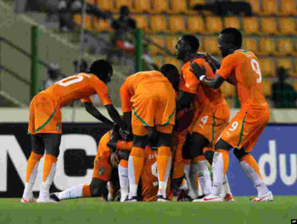 Ivory coast's players celebrate after scoring against Burkina Faso during their African Nations Cup soccer match in Malabo