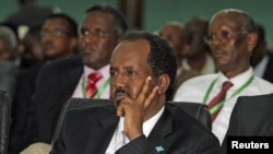 Somalia's newly elected President Hassan Sheikh Mohamud listens to proceedings after winning the election, in Mogadishu, September 10, 2012.