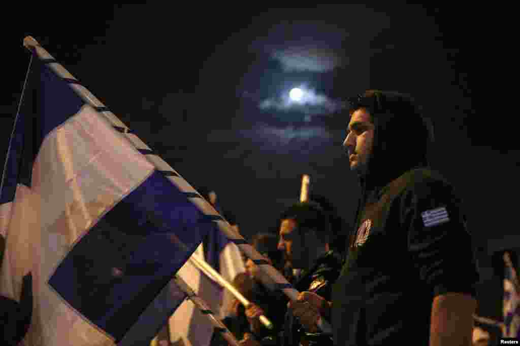 Supporters of the extreme right group National Popular Front (ELAM) take part in an anti-bailout protest outside parliament in Nicosia, Cyprus, March 28, 2013.